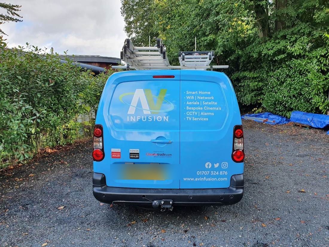Rear of the AV Infusion van listing Smart Home, WiFi, Aerials, Satellite, Cinema, CCTV and Alarm services